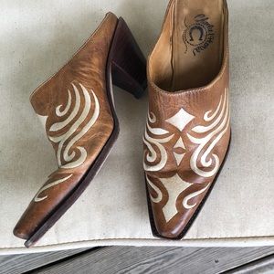 Beautiful cowboy style mules by Charlie One Horse